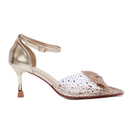 Ukrašene visoke pete sa zlatnom mašnom zlatni