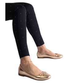 Zlatne balerinke ukrašene mašnom zlatni