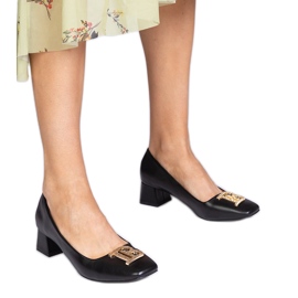 Crne crpke s niskim slovima sa zlatnim ukrasom crna