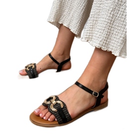 Crne ravne sandale sa zlatnim ukrasom crno