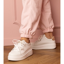 Bijele i zlatne sportske tenisice na platformi bijela 1